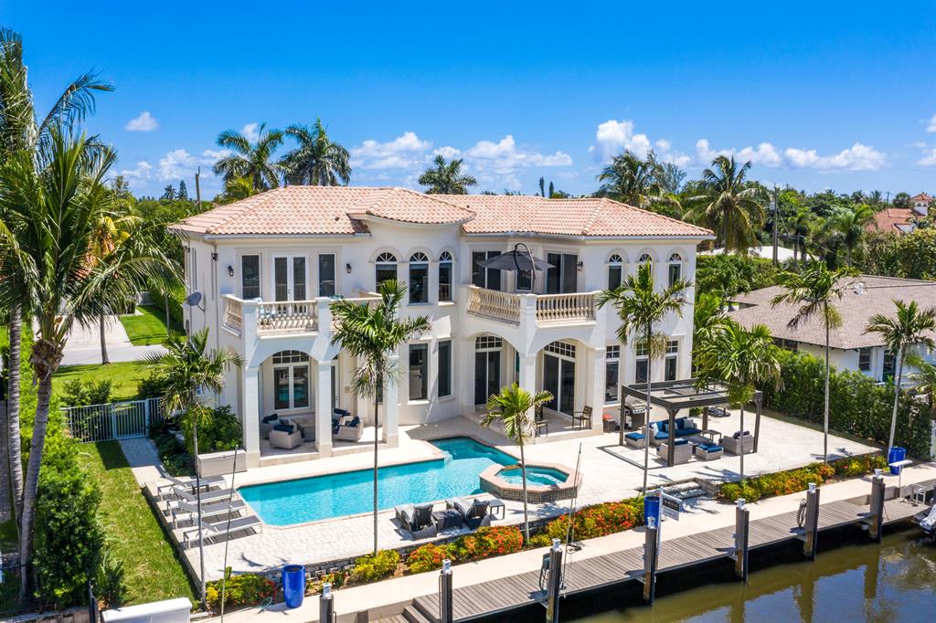 WOW! Turn the key & move on into this fully furnished contemporary deep water estate! Built in 2004, this 4bed/4bath single family home offers an elegant 25-foot entry ceiling, light & bright and making you feel right at home. The main living areas have soaring 14-foot ceilings throughout - refined mouldings, trims, archways & a decorative fireplace sprawling over 3,300 living sq ft. Stunning Saturnia Marble & wide plank wood floors, no carpet! Tall windows & doors (all Hurricane Impact) reveal the commanding water views from almost every point of the home in addition to 2 private balconies on the second level w/ the master facing directly towards the Intracoastal waterways.