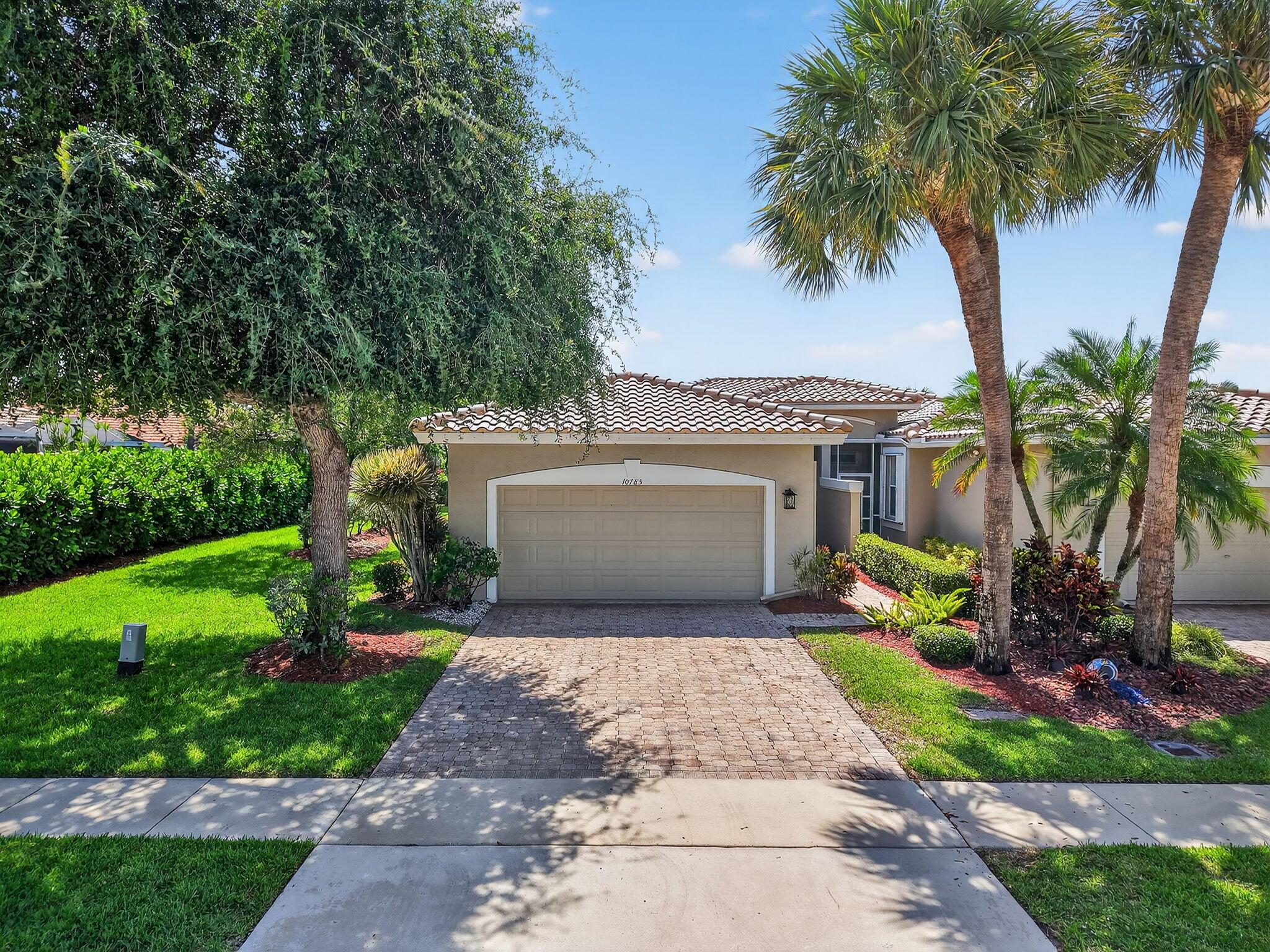 Amazing opportunity! Beautiful 3 bedroom, 2 bath villa (corner unit) with 2 car garage and lake view. This home has just been totally refreshed. Open floor plan with White Oak luxury vinyl flooring, large eat-in kitchen with new Shaker cabinets, quartz counter tops, marble tile backsplash, new Samsung stainless steel appliances, Kraus workstation sink and new led lighting. Primary bedroom has a large walk-in closet, en-suite bath with dual vanity and luxury shower. New roof (April 2025), new A/C (October 2023).Majestic Isles is a very desirable 55+ community featuring 450 Homes on 60 Plus acres with 3 Scenic Lakes and 24-hour manned guarded gate.