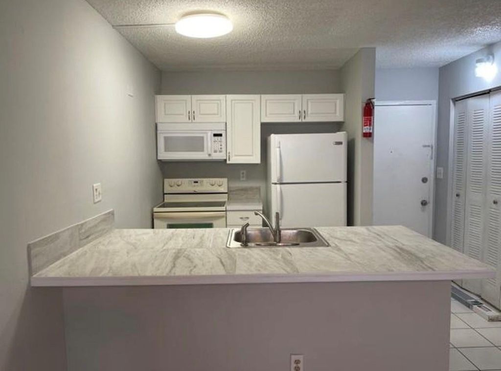 Photo of 2701 Riverside Drive #107b, Coral Springs, FL 33065 (MLS # F10555413)