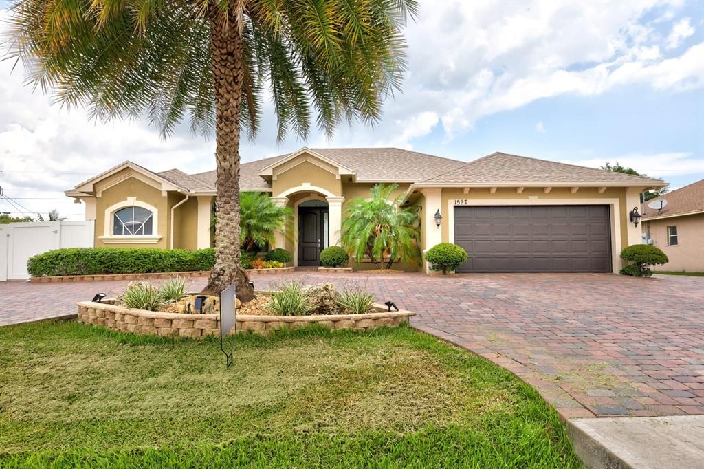 Photo of 1597 SW Neptune Avenue, Port Saint Lucie, FL 34953 (MLS # R10808727)