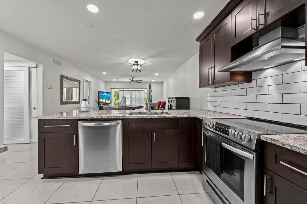 Photo of 647 Marlboro Oval, Greenacres, FL 33467 (MLS # B26007578)