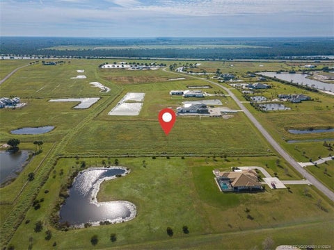Photo of 5951 SW SADDLEBROOK Lane, Palm City, FL 34990 (MLS # B26078097)