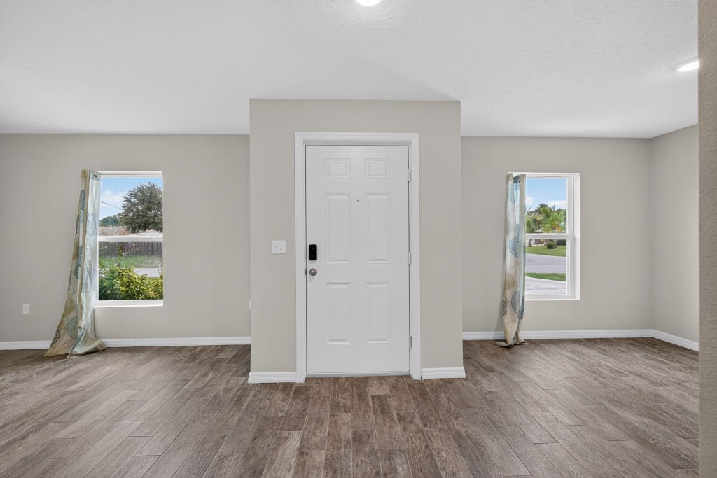 Photo of 3918 SW BRUNSWICK Street, Port Saint Lucie, FL 34953 (MLS # B26082334)