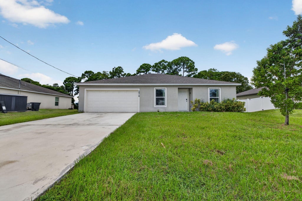 Photo of 3918 SW BRUNSWICK Street, Port Saint Lucie, FL 34953 (MLS # B26082334)