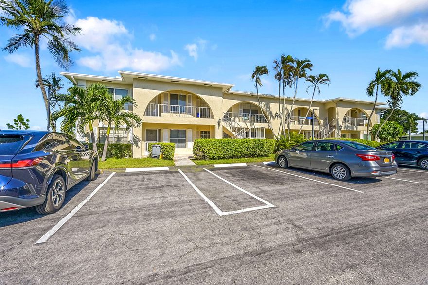 Gorgeous oversized lakefront corner villa in trendy Delray Beach. A must see. Hurricane Impact Windows, including a washer and dryer (in unit). This villa has a beautiful glass front door where you will enter the kitchen, with beautiful sleek  countertops. Off the spacious main living area is an extra-large patio .