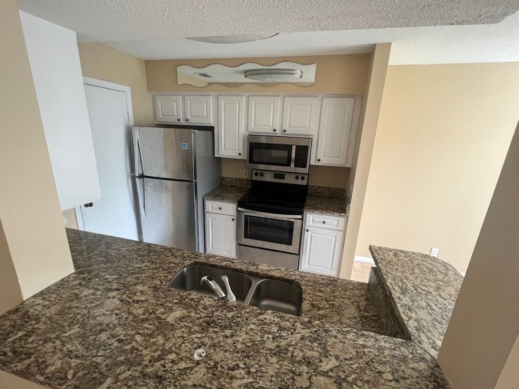 Photo of 815 W Boynton Beach Boulevard #204, Boynton Beach, FL 33426 (MLS # F10450064)