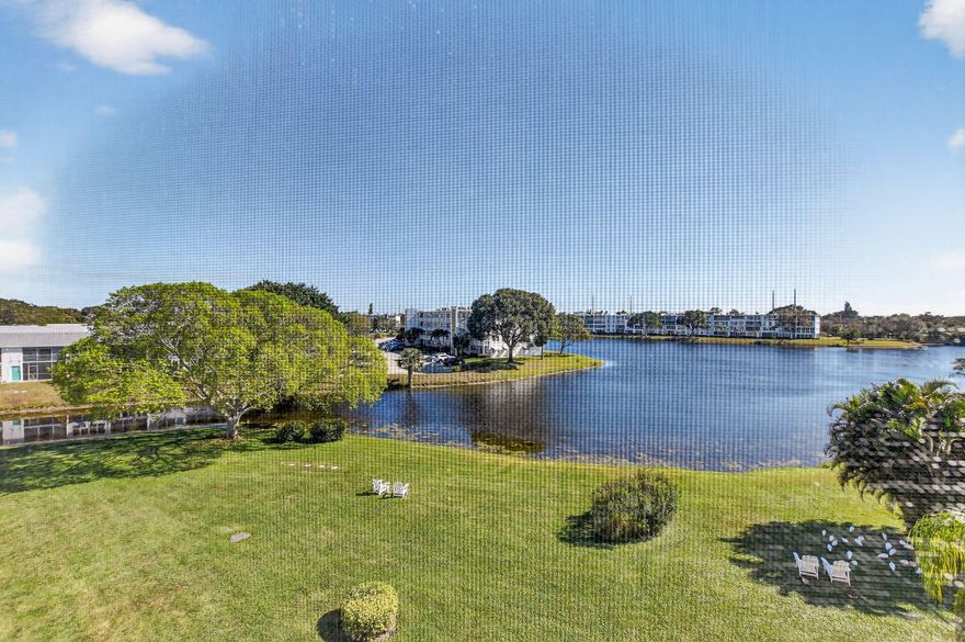 Enjoy picturesque water views from this immaculate 2-bedroom, 2-bath condo located in the prestigious Century Village community, within the highly desirable Oakridge V building. Situated on the 4th floor, this bright and spacious residence offers serene waterfront views from the large screened-in balcony — the perfect place to relax and unwind.

The unit features beautifully updated bathrooms, tile flooring throughout, and an abundance of storage closets. Being sold furnished, this move-in-ready condo is ideal for year-round living or as a seasonal retreat.

Century Village offers an exceptional lifestyle with resort-style amenities including 24-hour gated security, indoor and outdoor pools, clubhouse, fitness center, tennis courts, common laundry, and a wide array of social activities.

Conveniently located near shopping, dining, beaches, and transportation, everything you need is just moments away. This is truly a must-see opportunity!