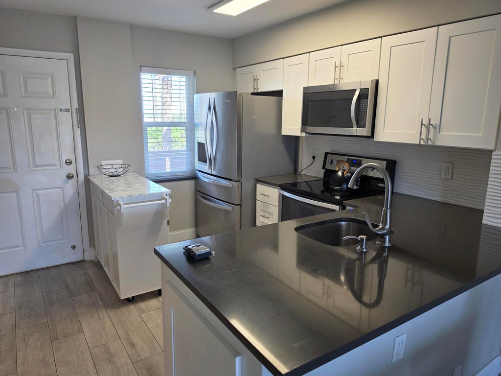 Photo of 2106 S Cypress Bend Drive #510, Pompano Beach, FL 33069 (MLS # B26050049)