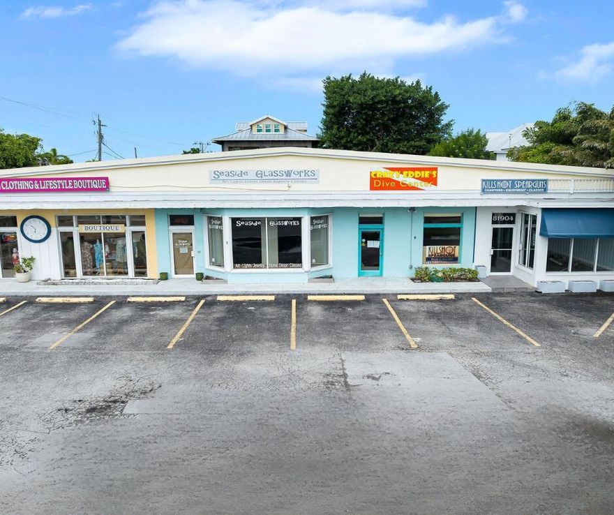 Prime downtown Islamorada commercial property featuring 5,232 SF of retail space across four bays on a 15,000 SF large corner lot with excellent US-1 frontage. More than 50 years of continuous retail use makes this a well-known and highly visible location with both strong drive-by exposure and pedestrian access. Village Center zoning allows for future expansion or mixed-use possibilities, including second-story development or workforce housing (subject to approvals). Two long-term tenants are currently in place and would like to remain, offering stable income for the next owner. The third and fourth bays are currently vacant and available for immediate use or lease -- an ideal opportunity to secure new tenants or owner occupancy before the holiday season.