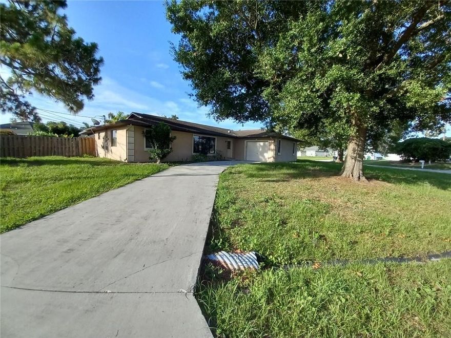 PRICE JUST REDUCED!! SPACIOUS 3/2 HOME FRESHLY PAINTED, TILE AND NEW CARPET, FIREPLACE, SPACIOUS LAYOUT, OVER 1800+SQ.FT. OF LIVING, SCREENED PATIO AND NO HOA!! CORPORATION OWNED SEE SELLERS ADDENDUM. VIEW BROKER REMARKS. NEW SS APPLIANCES COMING SOON!!