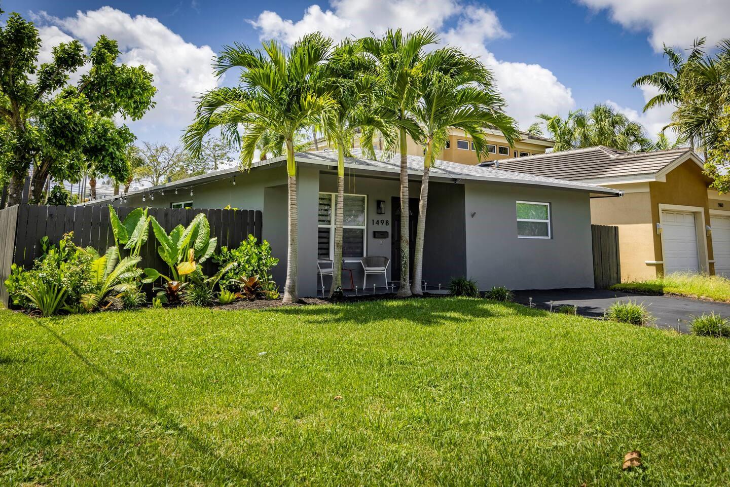 Beautifully renovated 4-bed, 3-bath home with bright open layout, luxury vinyl floors, and a sleek modern kitchen featuring quartz countertops and stainless steel appliances. Enjoy a stylish living space, spacious bedrooms, and updated baths.
Includes a fully equipped 1-bed/1-bath guest suite with its own private entrance and living area—ideal fo guests, or rental income.
The fenced backyard is a tropical retreat with lush greenery, a hanging chair swing, BBQ area, and outdoor dining space. Prime location near Wilton Manors, the beach, shops, and more!
?? Minutes to the beach, Wilton Manors, Funky Buddha, shopping, dining, and more. Move-in ready—just bring your suitcase!