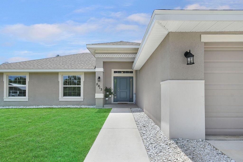 Photo of 5913 Balsam Drive, Fort Pierce, FL 34982 (MLS # R11011600)