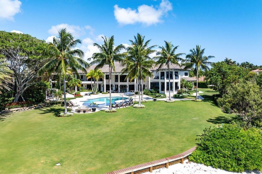 Experience the waterfront dream in this completely renovated home sitting on 1.3 acres and appx 320' of direct intracoastal waterfront with unobstructed views. This 12,000 SF home truly has it all.Beautiful finishes accompany every amenity you can think of on this property. Golf Simulator room, Full gym and spa with cold plunge and exterior sauna, summer kitchen, full size putting green with sand trap, oversized pool with resort style spa, cabana, firepit area, private beach, dock on property large enough for 100'+ boat.Main House features 5 bedrooms, all with en-suite baths. 2 offices (1 off the master), golf simulator, living room with a bar and beautiful oversized kitchen leading to the family room