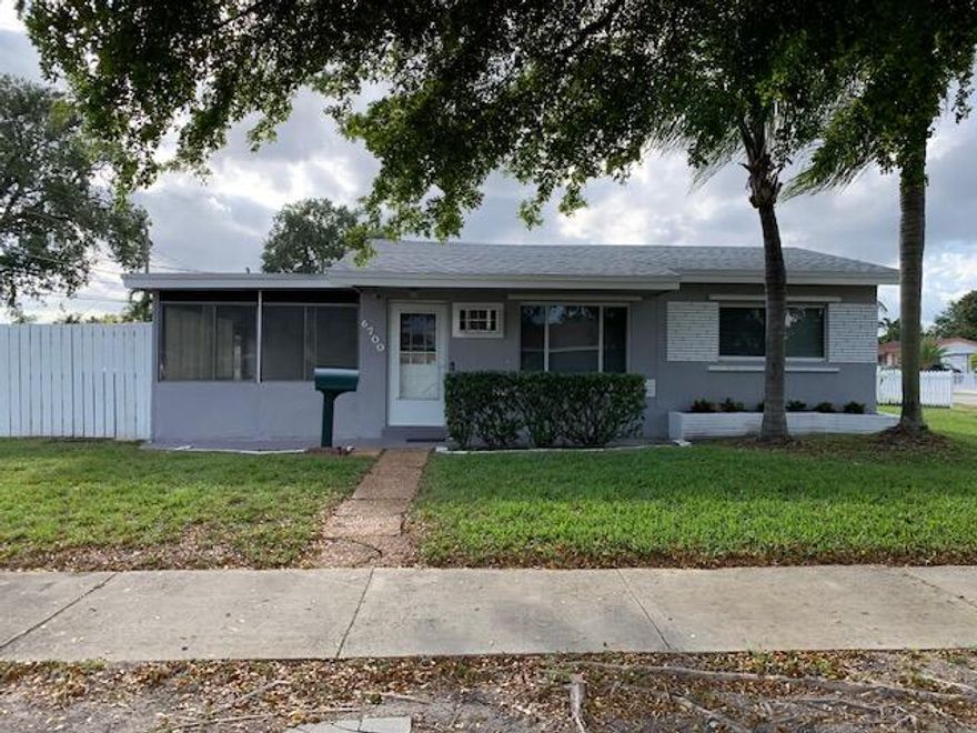 Single family home in central Hollywood with no HOA, ideally located on a corner lot just minutes from Hard Rock Casino & Hotel. This two-bedroom, one-bath property features a new roof (2024), tile floors throughout the main living areas, and a nicely finished tiled bathroom. The kitchen offers wood cabinetry and stainless steel appliances. A Florida room provides additional flexible living space and includes a portable AC unit for added comfort. Enjoy a large, fully fenced backyard with plenty of room for entertaining, pets, or future expansion. Centrally located with convenient access to major roadways, shopping, dining, and entertainment.