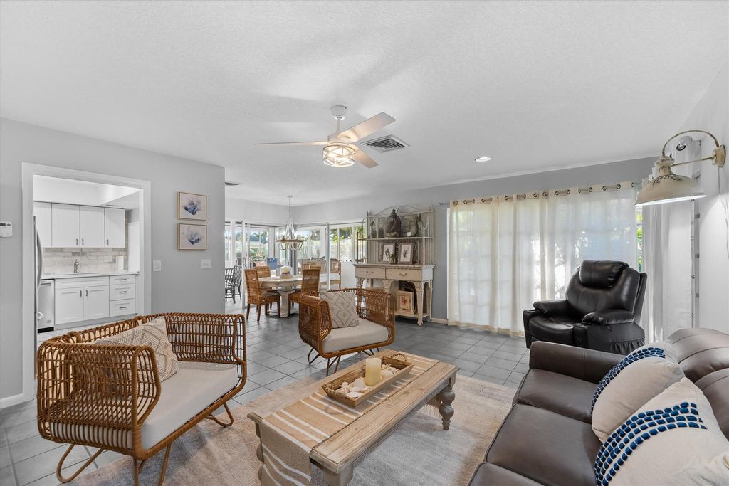 Photo of 102 Villa Circle, Atlantis, FL 33462 (MLS # R11078454)