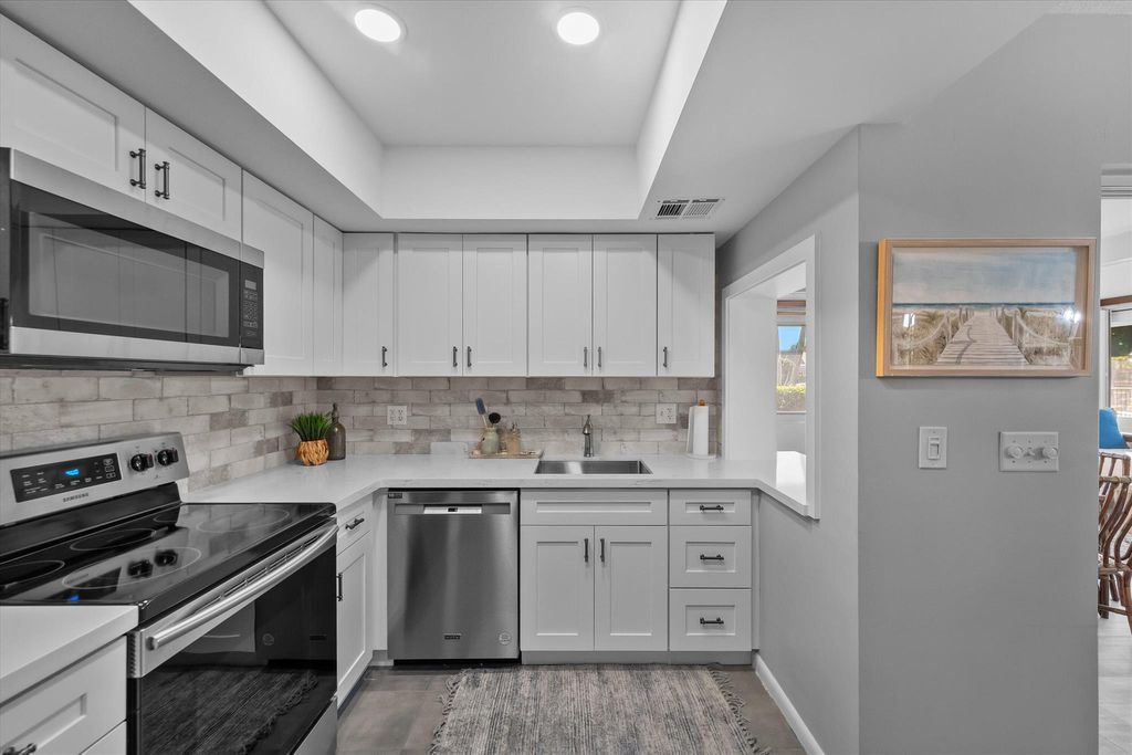 Photo of 102 Villa Circle, Atlantis, FL 33462 (MLS # R11078454)