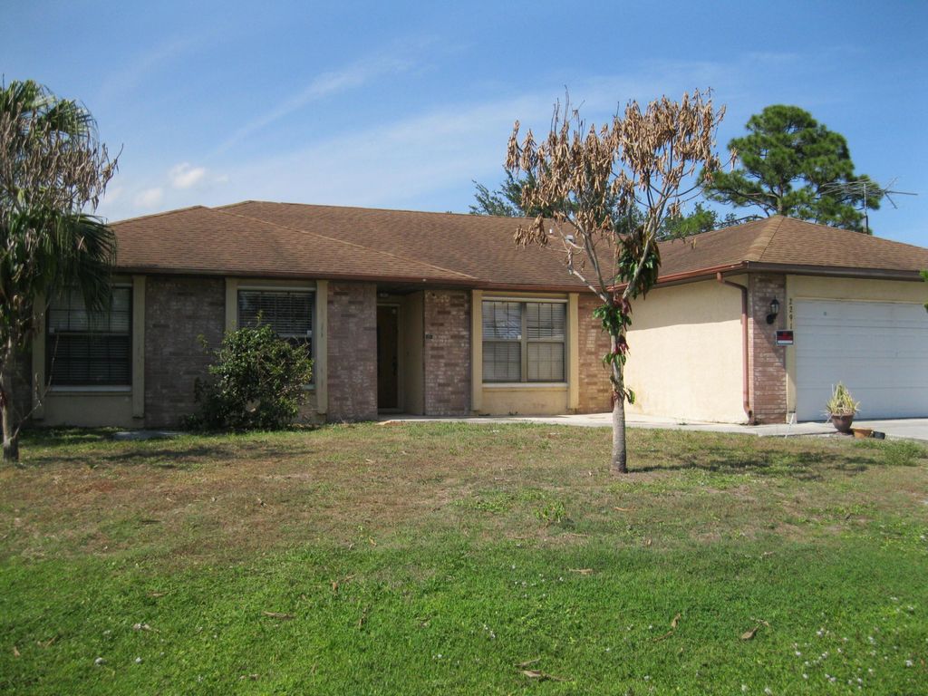 Photo of 2291 SW Jay Avenue, Port Saint Lucie, FL 34953 (MLS # B26020896)