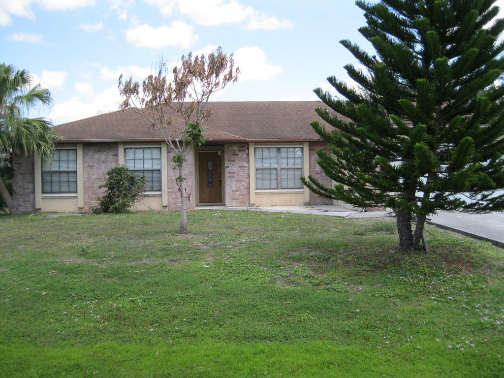 Photo of 2291 SW Jay Avenue, Port Saint Lucie, FL 34953 (MLS # B26020896)