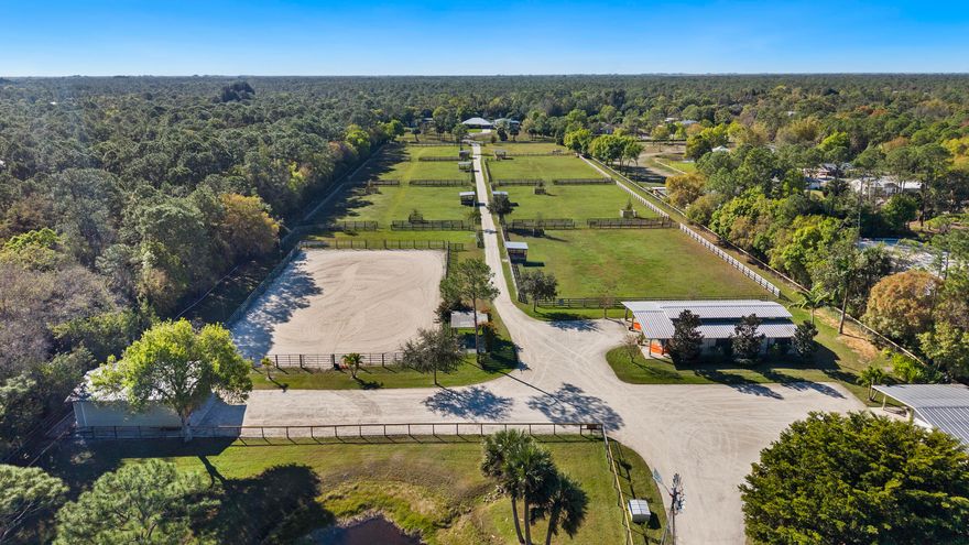 Discover a rare opportunity to own a fully fenced, thoughtfully designed 10-acre horse farm. With a 3/2 home (2022 roof), six-stall center-aisle barn with an air-conditioned tack room/office, plus a second three-stall barn with new Lucas Equine stall fronts.   A 200' x 100' lighted arena, eight fenced paddocks with waterers, electric tape fencing, and drinking posts make it an exceptional equestrian property. Additional features include a storage/workshop with covered parking, spray-foam attic insulation, Vector security system, and new washer and dryer. Two separate entrances from Quail Hollow St and Ranchito St add flexibility, and there is ample space to build an additional home. Ideal for personal use or a training/boarding operation, this property is minutes from I-95, the Turnpike,