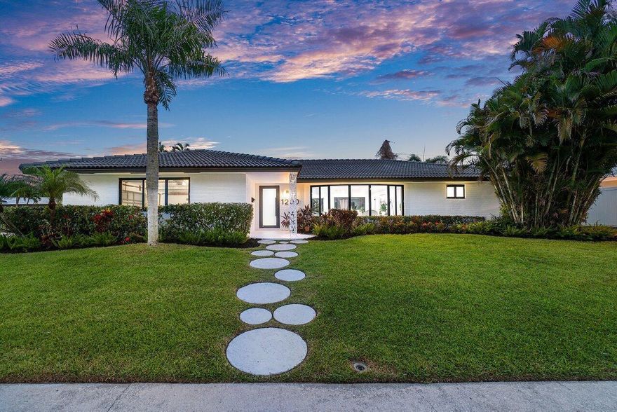 Step into this stunningly renovated 4-bedroom, 3-bathroom pool home in coveted Boca Square, where luxury meets comfort. Every corner of this home exudes thoughtful design and exceptional upgrades. The open-concept floor plan creates a seamless flow between the living room, dining area, and kitchen, making it ideal for everyday living and entertaining. Sunlight floods the space through large impact windows and doors, enhancing the warm and inviting atmosphere. The kitchen is a chef's delight, featuring modern appliances, quartz countertops, and ample cabinetry. The large central island doubles as a workspace and a casual dining spot, perfect for quick bites or gathering with loved ones while cooking. The home offers four spacious bedrooms, each designed as a comfortable retreat. The master suite is a true oasis, complete with a luxurious en-suite bathroom and a walk-in closet. The additional bedrooms share beautifully updated bathrooms, all featuring modern fixtures, stylish tiling, and a fresh, contemporary color scheme. The master bathroom stands out with its spa-like feel, large shower, and dual sinks.  Step outside to your private backyard oasis, where a sparkling pool and spa-like patio await. The fenced yard offers privacy, and the additional shed provides extra storage. There's also room for RV or boat parking, adding even more convenience to this incredible property.  With no HOA and a prime location just minutes from top-rated schools (Addison Mizner, Boca Middle, and Boca High), Mizner Park, beaches, parks, restaurants, airports, major highways, and the world-renowned Boca Raton Resort, this Boca Square gem truly has it all. Experience the best of the Florida lifestyle in this beautifully updated home!