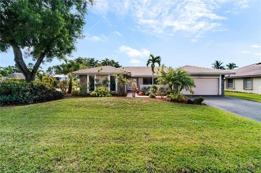 Updated home in highly desirable Cypress Run neighborhood of Coral Springs! Situated on a waterfront corner lot with impact windows & accordion shutters for hurricane protection. The kitchen features an eat-in area plenty of counter space.  Vaulted ceilings make this large house feel even larger! Tile & laminate wood flooring throughout the house – NO CARPET! 2nd bathroom has been beautifully updated with new vanity, new tile, & granite counter top! Oversized master bedroom features a large walk-in closet, his/hers vanities in the updated bathroom, and a walk-in shower. Master bathroom cabana door leads out to the private pool deck with tropical views. No HOA! Walking distance to Cypress Park, Cypress Water Park, & Orchid Park. Near shops, restaurants, great schools, and major highways!
