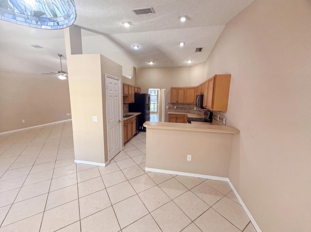 Photo of 3642 SW Sterricker Street, Port Saint Lucie, FL 34953 (MLS # B26049743)