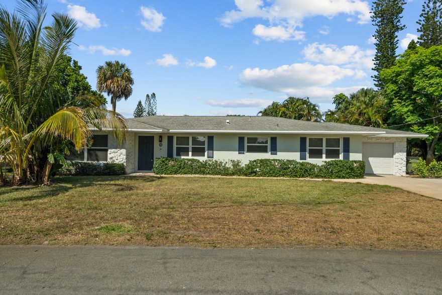 New metal roof in 2026 and interior completely remodeled in 2024 with impact glass windows, doors, and garage door, new quartz countertops, all-new appliances, luxury vinyl plank throughout, and two fully renovated bathrooms with new tile, vanities, and fixtures. No HOA. The layout includes an entryway, living room, eat-in kitchen and family room. The primary suite has a walk-in closet and double sinks. Three bedrooms, two bathrooms. Deep garage with laundry and utility sink. Corner lot in a highly desirable Stuart neighborhood already connected to city water and sewer. Located just minutes from downtown Stuart, waterfront parks, bike paths, the river and public beaches!