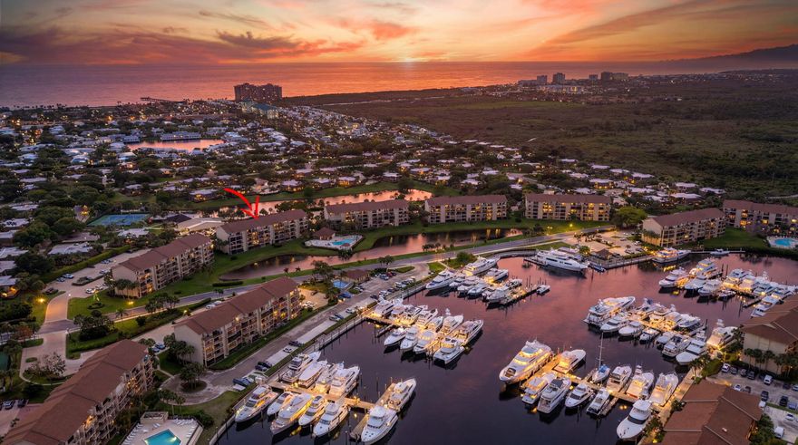 THE BEST VALUE IN THE MARINA !  TOP FLOOR UNIT WITH SOME MAJOR UPGRADES COMPLETE!  Don't miss the lowest-priced opportunity to own a top-floor residence at Marina at the Bluffs! This "clean slate" unit is perfect for the buyer who wants the peace of mind of some major upgrades without paying for someone else's design choices.  Enjoy soaring vaulted ceilings and a bright, airy floor plan with no neighbors above you.  Large balcony to enjoy sunsets and morning coffee.  High-ticket items are already done: Full IMPACT-RATED windows and sliders, a newer A/C, and a newer hot water heater. The master shower has been tastefully updated, leaving you the fun part—customizing the kitchen, flooring, closets to your exact taste. Steps from the famous Dog Beach, shops, restaurants and 15 minutes to PBI!