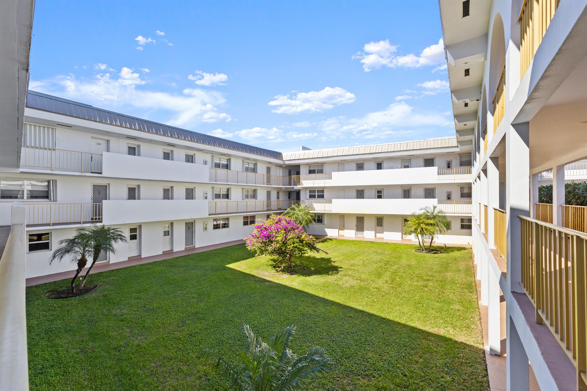 Charming, furnished corner unit with wood floors and flexible living space. The den converts easily to a second bedroom or a dedicated home office. Enjoy a bright screened porch with a peaceful view of a landscaped courtyard framed by mature canopy. The turnkey kitchen includes a brand new refrigerator, stove and microwave. The community pool is well maintained and often feels tucked away and quiet. Excellent East Boca location with easy I-95 access and just minutes to the beach, Mizner Park dining and shopping, and local conveniences. Ideal for first time buyers, seasonal residents or investors.