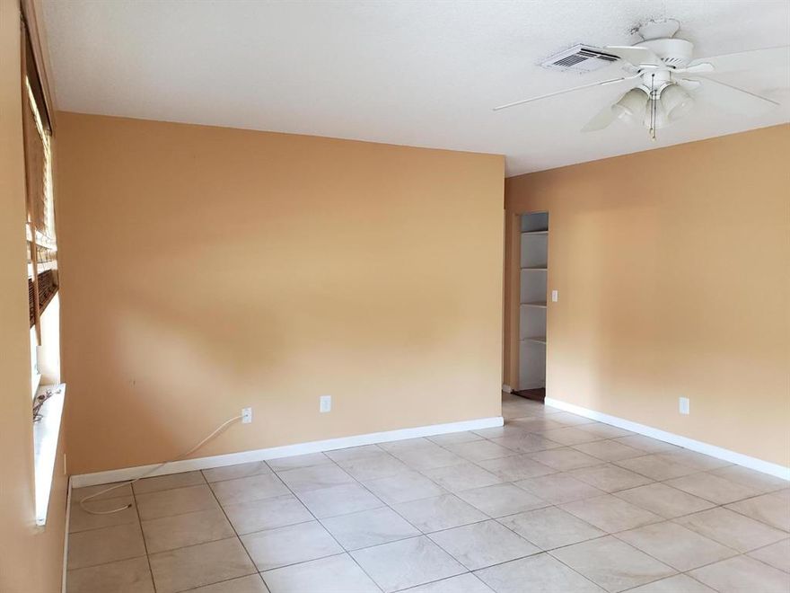 Lovely 3 bed/2 bath home on a quiet street in Stuart. This attractive home has tile and wood flooring throughout. It is light and bright. Main bedroom has extra large reach in closet for plenty of storage. Bedroom 2 has a walk in closet.  
Bedroom 3 has a full shower bath but no built-in closet. The covered screened patio is very spacious at 16 ft x 12 ft. Good sized laundry room with washer and dryer. Kitchen is a galley kitchen with Refrigerator, Range, Dishwasher and plenty of cabinets for storage. Detached 10'x12' amazing shed with lots of space and workbenches and an a/c unit &  power for workshop type activities. No HOA. Great location just w US 1.  Lawn maintenance is included in the rent. City water is being brought into the neighborhood. Owner prefers 2 year lease. Contact me.