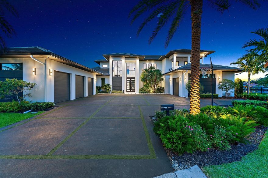 Discover unparalleled luxury in this one of a kind waterfront estate, ideally situated on a rare point lot in the exclusive, gated community of the Islands of Jupiter. This opulent residence boasts 5 spacious bedrooms and 6.5 elegantly appointed bathrooms, including a separate guest quarter. The architectural contemporary design features floating interior walls and flush wall doors, creating a sleek and modern aesthetic. The expansive living space is perfect for both grand entertaining and intimate family living. Each generously sized bedroom offers a private retreat with elegant finishes, while the spa-like bathrooms include a lavish ground floor  master suite with a steam room for ultimate relaxation. The second floor includes three bedroom additional laundry, and an expansive loft.