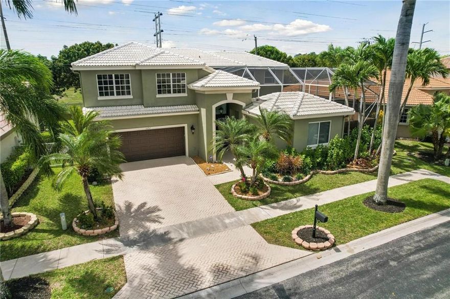 Beautiful Updated Courtyard home in West Boca. Home has everything 5 beautiful bedrooms + 3.5 bathrooms. Lg EIK W/ updated Stainless Steel Appliances, which opens up to a lg family room overlooking the oversized pool and yard.  Large D/R, L/R with 20 ft ceilings. Upstairs offers 4 lg bedrooms and 2 full bathrooms. Primary has a sitting area with two walk-in closets, dual sinks, & a soaker tub & a separate shower. Amazing guest house located by the pool, w/ lg bedroom, full bathroom & Lg closet. Private lg yard. Low HOA, includes Clubhouse,resort-style amenities, fitness center, pool, playground, & tennis courts. A-Rated Schools, prime location, close to restaurants & shopping, & new uptown Boca lifestyle center.