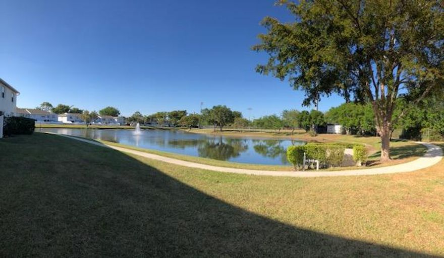 EASY, BREEZY, FUN, LIGHT, FRIENDLY, SPACIOUS COMMUNITY and a MOVE IN READY  OUTSTANDING END UNIT!  This home is solid! . Has a new 3.5 ton AC  Central Air Unit.  Brand new 40 gal. hot water tank! Nice brushed nickle fixtures.  8' sliding glass doors out to the lake and walkway with a fountain view while at your personal BBQ area!  Bedrooms are large and bright with LOTS of closet space!  Ceiling fans throughout the home.  W/D in garage.  PLENTY of storage.  Secret storage as well! Low HOA provides a pool & spa, lawn maintenance, pest control, roof care, power washing.  Plenty of guest parking and open space throughout this community.   This community is snuggled nicely and close to lots of shopping and restaurants.  Close to Beach and Parks also.  DO NOT MISS THIS WELCOMING HOME!