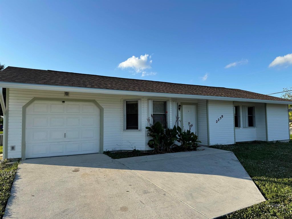 Photo of 2250 SW Pamona Street, Port Saint Lucie, FL 34953 (MLS # R11048083)