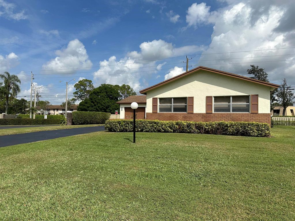 Photo of 6101 Rainbow Circle, Greenacres, FL 33463 (MLS # R11096596)