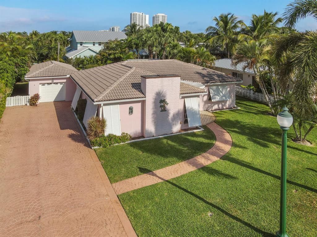 Photo of 227 Edwards Lane Ln, Palm Beach Shores, FL 33404 (MLS # R10756946)