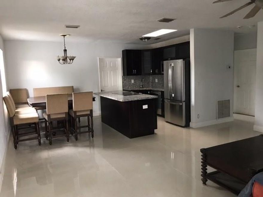 FULLY UPDATED  3 br/2 bath plus separate 1 br / 1 bath guest house. Enjoy an open pool/spa in a double size fenced lot in the hottest spot in Fort Lauderdale just blocks south of Wilton Manors and a few minutes driving distance to the Beach and downtown. Updated baths, New granite kitchen with high grade stainless steel appliances, new central ac, new porcelain floors throughout, freshly painted.  Plenty of parking for your boat or RV.  You can sublet the guest house for extra income. Unfurnished.PETS OK!