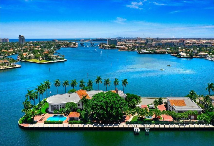 Truly one of the most iconic & substantial deep water Estates in Broward! La Maison Blanche offers finest wide open intracoastal views & entire point of the isle-1.4 acres/817 feet of deep water front + 370ft  protected side dockage. Potential to dock upto 200 ft yacht on South & 100ft yacht on East. Enjoy the ambiance of private island living, elegant Colonial style architecture & luxurious detailing.Main residence has gracious formal entertaining options, great room, theater, a Chef's kitchen & fun casual areas, all open to expansive terraces & balconies.Main Master Suite is stunningly appointed + two additional Master Suites & other large bedroom suites occupy a private wing. Manicured grounds & pool pavilion. Separate Guest House offers 2 apartments, 8 car garage & full house generator Air Conditioned Garages perfect for the auto collector plus height to add car lifts for additional garagingIncredible opportunity to create a family compound or corporate retreat.The docks are already in place with land leases.  However, dredging and pilings may need to be completed depending upon the yacht & dockage configurations.