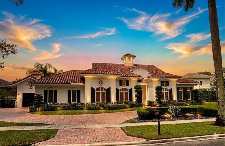 MUST SEE! This spectacular, one-of-a-kind Palm Beach-style ranch estate is set on just under half an acre (18,842 sq ft lot) and offers the perfect blend of luxury, comfort, and breathtaking lakefront views. This expansive one-story residence features 5 bedrooms, 4.5 bath plus a beautifully redesigned den/office, thoughtfully curated by high-end designers and a 3 car garage. Enjoy stunning long lake views from your private backyard oasis, complete with a sparkling salt pool and automatic retractable awnings.Inside, the home is beautifully appointed with premium finishes throughout, including stunning Cristallo quartzite kitchen countertops, top-of-the-line stainless steel appliances, a Sub-Zero refrigerator, and a built-in wine refrigerator. The office has been professionally  redesigned by high end designers. Additional highlights include impact windows and doors a full-house generator, and central vacuum. This exceptional home combines timeless Palm Beach elegance with modern upgrades and an unbeatable lakefront setting offering a rare opportunity to own a truly distinctive estate in one of the area's most sought after communities. Hawks Landing offers an unparalleled living experience, combining luxury and convenience within a secure, gated community. Residents enjoy access to an impressive 15,000 sq ft clubhouse that serves as the heart of the community, perfect for social gatherings and events. The community's resort-style swimming pool, both currently being remodeled to enhance their features and offer an even more luxurious experience. The community also offers a  state-of-the-art fitness center, complete with personal trainers and professional aerobic to keep residents in peak shape. For tennis enthusiasts, Hawks Landing boasts 7 lighted Har-Tru tennis courts, with private lessons and clinics available to perfect your game. The community also features a full-service spa, ensuring residents can enjoy a day of relaxation without leaving home. Active residents can enjoy the volleyball and basketball courts, as well as a playground for the kids. Families will appreciate the organized children's activities, including movie nights, pizza parties, and arts and crafts, creating a true sense of community for all ages. With its combination of luxury, recreation, and family friendly features, Hawks Landing offers a lifestyle that's second to none. **Please note: The chandelier in the kitchen, TV, Sonos system, and bracket in the bedroom with the couch do not convey with the property. **