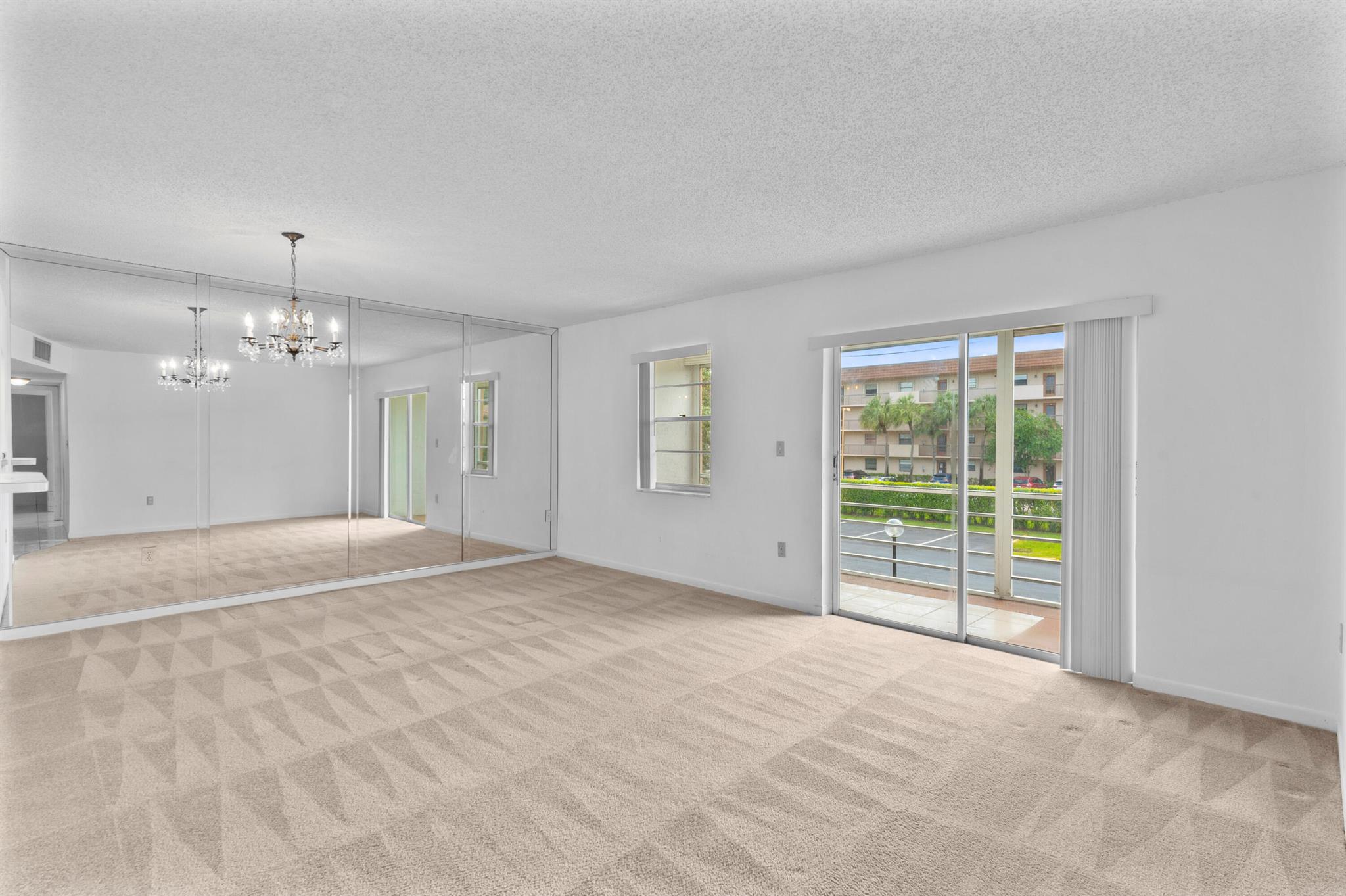 Bright & Airy 2/2 condo located at Sabal Palm Village in Tamarac, 55+ Community. This cozy unit is located on the 2nd floor next to elevator and features carpet & tile flooring. Large white kitchen with small pass through to living room area. NEW A/C and 2014 W/Heater, Large master bedroom with walk-in closet and stand-up shower. Guest bedroom has mirrored closet. Screened tiled patio - Can be used as a Den/Office. Laundry room on premises located on same floor, unit comes with extra storage room. The association offers a clubhouse with library, fitness room, heated pool, BBQ area & tennis courts. Secured Lobby. Mins to Turnpike, Shopping Plazas and Restaurants. Schedule your viewing today!