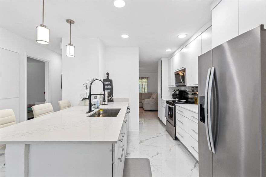 Beautifully remodeled 3-bedroom, 2-bathroom single-family home in Coral Springs. This stunning property features luxurious marble floors throughout, a modern kitchen with granite countertops, and stylish barn closet doors. Hurricane impact windows provide peace of mind, and the home is designed with thoughtful upgrades at every turn. Enjoy the convenience of a 1-car garage and the freedom of a no-HOA community. Located near the Coral Springs Sportsplex, enjoy amenities like tennis, swimming, and sports fields. Nearby attractions include the Coral Springs Museum of Art, Sawgrass Nature Center, and lively downtown dining. With proximity to Coral Square Mall, parks, restaurants, and major highways, this home combines modern living with endless recreation opportunities. Don’t miss out!