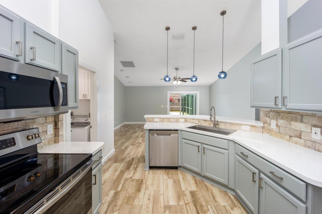 Photo of 2544 SW Deckard Street, Port Saint Lucie, FL 34953 (MLS # R11071514)