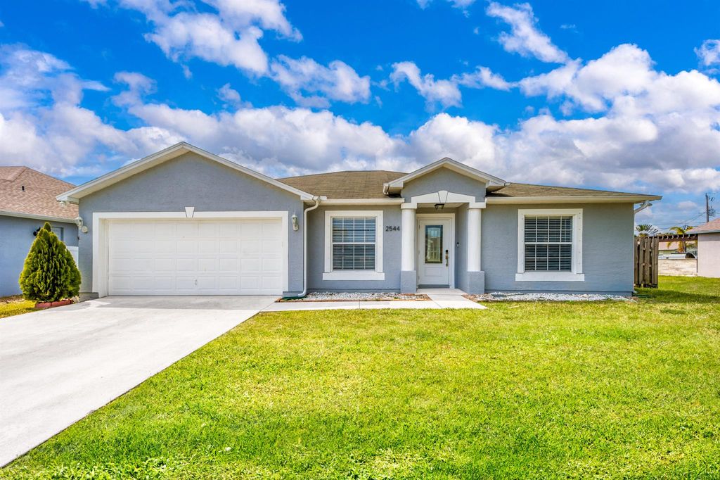 Photo of 2544 SW Deckard Street, Port Saint Lucie, FL 34953 (MLS # R11071514)