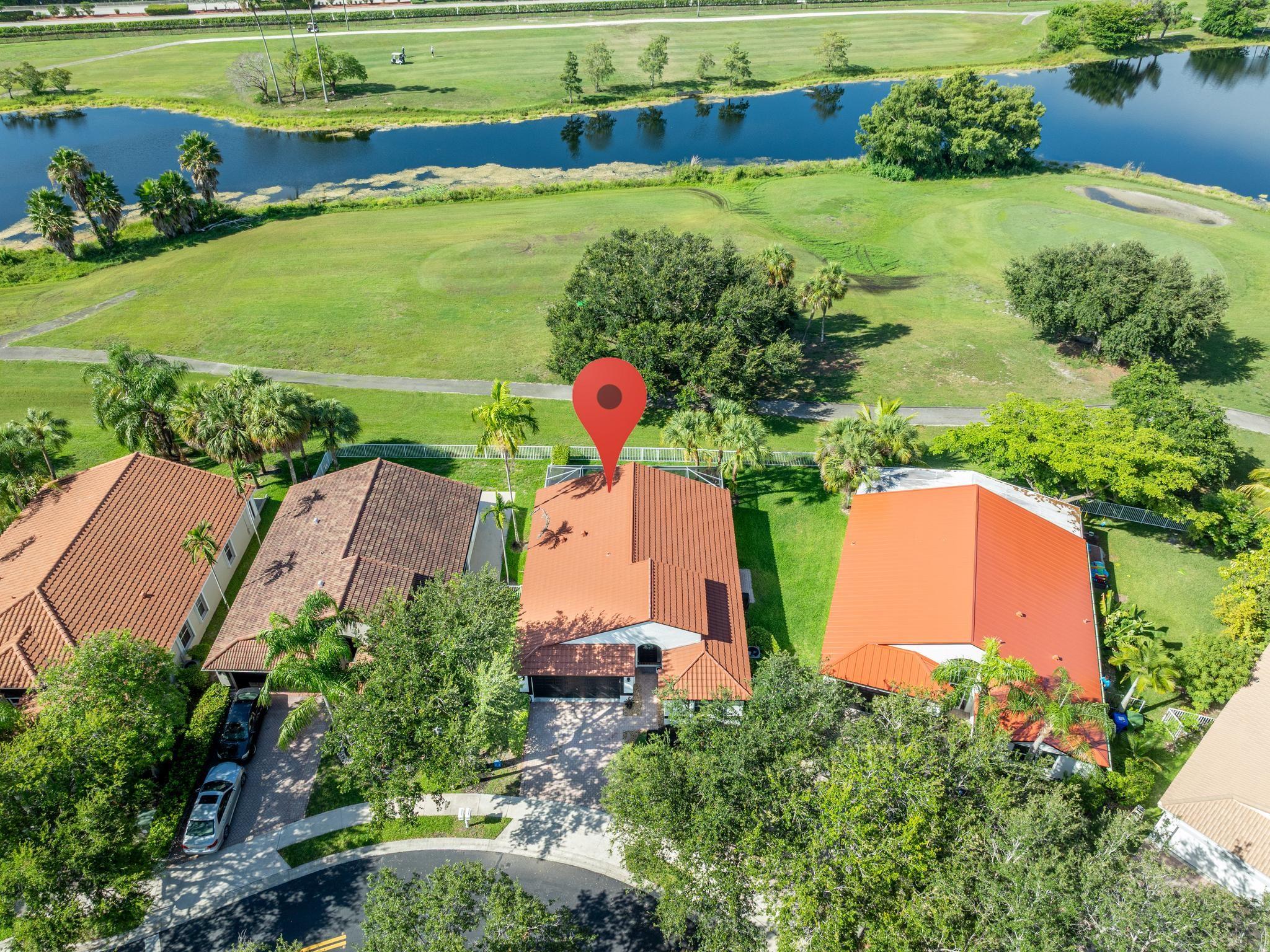 SPECTACULAR LAKE AND GOLF VIEWS FROM THIS SPACIOUS AND BRIGHT 3 BEDROOM 2 BATH HOME TWO CAR GARAGE IN DESIRABLE GATED COMMUNITY OF GRAND PALMS* RENOVATED IN 2019, WITH NEW KITCHEN, QUARTZ TOPS, SS APPLIANCES, WASHER/DRYER, CRATE & BARREL LIGHT FIXTURES, RE-PIPE 2019. TILE METAL ROOF 2018, A/C 2021, SPACIOUS MASTER BEDROOM W/WALK-IN CLOSETS, MASTER BATH WITH DUAL SINKS, SEAMLESS GLASS SHOWER DOOR, SPLIT BEDROOM PLAN, HIGH CEILINGS. ENJOY PEACEFUL VIEWS OF THE LAKE & GOLF COURSE FROM THE HUGE SCREENED IN PATIO W/BRICK PAVERS, FENCED YARD, FRESHLY PAINTED 2024, ACCORDIAN SHUTTERS, MAINTENANCE INCLUDES COMMUNITY POOL, EXTERIOR PAINTING, ADT ALARM/MONITORING, CABLE, INTERNET, LAWN/SPRINKLERS MAINTENANCE, IRRIGATION, MANNED GATE, RESIDENT ONLY 2ND GATE. A MUST-SEE! EASY TO SHOW