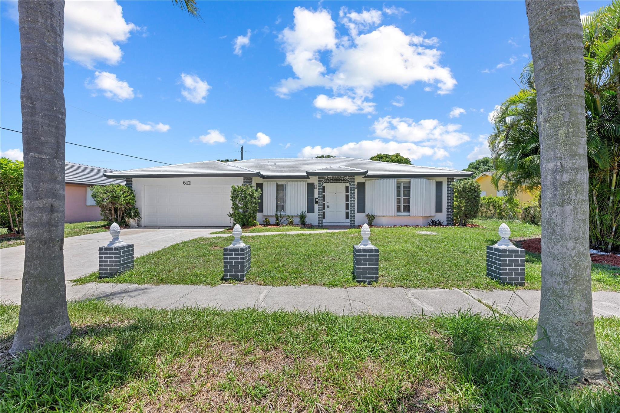 Beautifully updated 4 bed, 2 bath home in the heart of West Palm Beach featuring brand new flooring, fresh paint, and a modern kitchen and baths with quartz countertops. Enjoy a spacious screened-in patio perfect for relaxing or entertaining, plus a private garage for added convenience and storage. Located just minutes from Downtown West Palm Beach, Clematis Street, The Square, and the Brightline station, with easy access to I-95 and the beach. Nestled near scenic Clear Lake in a quiet, walkable neighborhood with no HOA. Ideal for first-time buyers, seasonal residents, or investors seeking a turnkey property in a rapidly growing area.