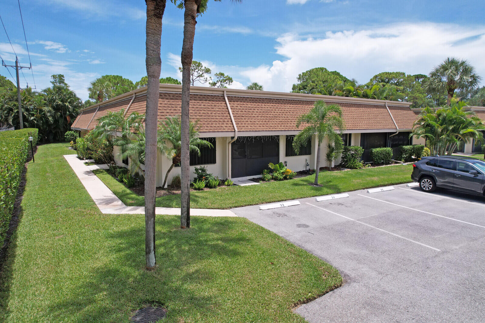 Beautifully renovated villa in the heart of Jupiter! One level with 2 bedrooms and 2 full bathrooms plus a den and patio make this home more than 1700 square feet. Luxury vinyl flooring throughout plus smart appliances, sky light in master bath with a large soaking tub and walk-in shower. This villa backs up to a fenced, wooded area to offer privacy. Two assigned parking spaces are right outside the front door. HOA includes basic cable, landscaping, exterior paint, 4 years remaining on roof warranty. Pets and trucks allowed with restrictions. Schedule a showing today!