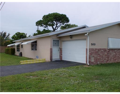 Adorable, renovated 2/2 PLUS family room (can be used as an office or 3rd bedroom) single family home with 1 car garage in desirable East Boca community. New stainless steel appliances, new kitchen cabinets, granite counter top. New vanities in bathrooms, new ceramic tiles in living areas. AC 1 yr old. Full size washer dryer in the garage, nice size back yard. Covered patio in a quiet East Boca neighborhood. Close to I-95, beaches, schools, shipping and houses of worship.