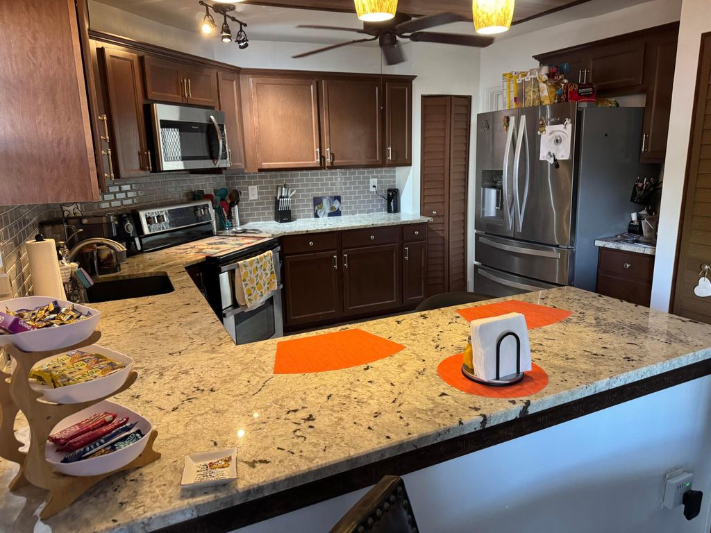 Photo of 7 Greenway Village Vlg N #103, Royal Palm Beach, FL 33411 (MLS # R11127421)