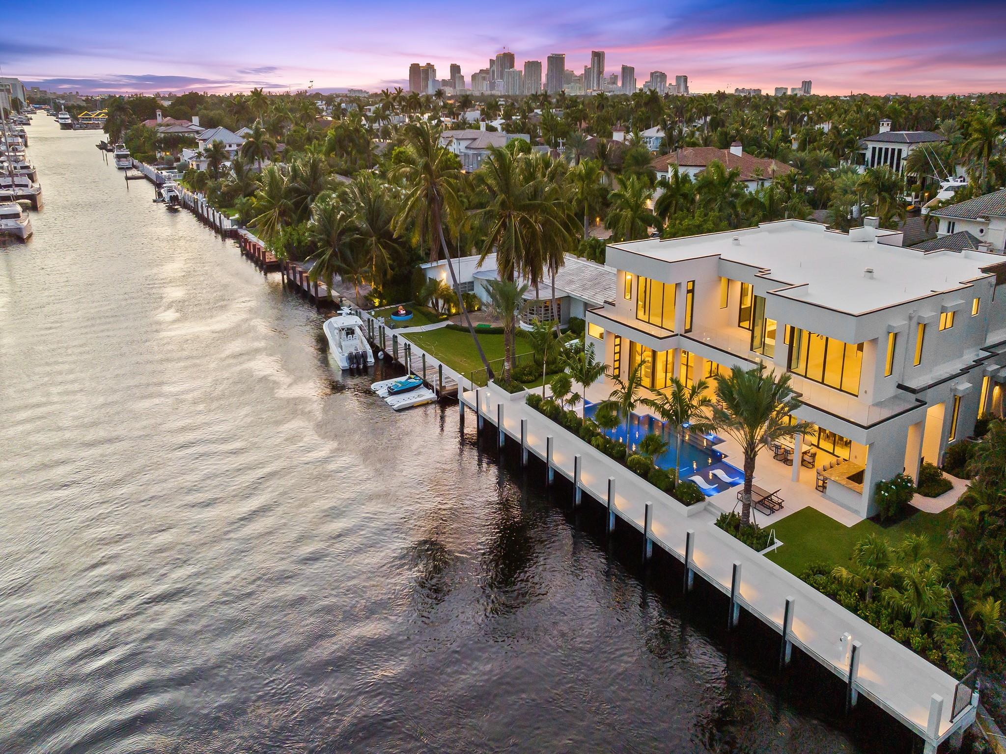Live the true "South Florida Lifestyle" in this newly built chic contemporary home located at Port Everglade's Harbor Beach. Secure gated waterfront community with lakefront marina and owners-only private beach club on the Atlantic. Spacious walls of glass and lots of warm natural light. 123' dock on deep wide canal & southern water views! Dock up to 103' yacht. 6 ensuite bedrooms, 2 powder rooms, kitchen with breakfast area, clubroom and bar, library, dining & wine room, summer kitchen, 4-car garage with room for lifts, lots of covered & open balconies and lanais, designer pool and spa. Conveniently located near FTL Intl Airport, upscale shopping and dining and 10 minutes to Port Everglades out to the Atlantic! Welcome Home!!!