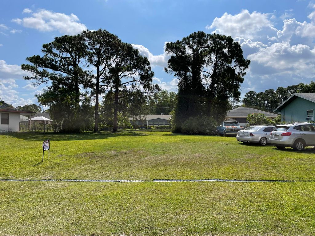 Photo of 1825 SW Logan Street, Port Saint Lucie, FL 34953 (MLS # R10802317)